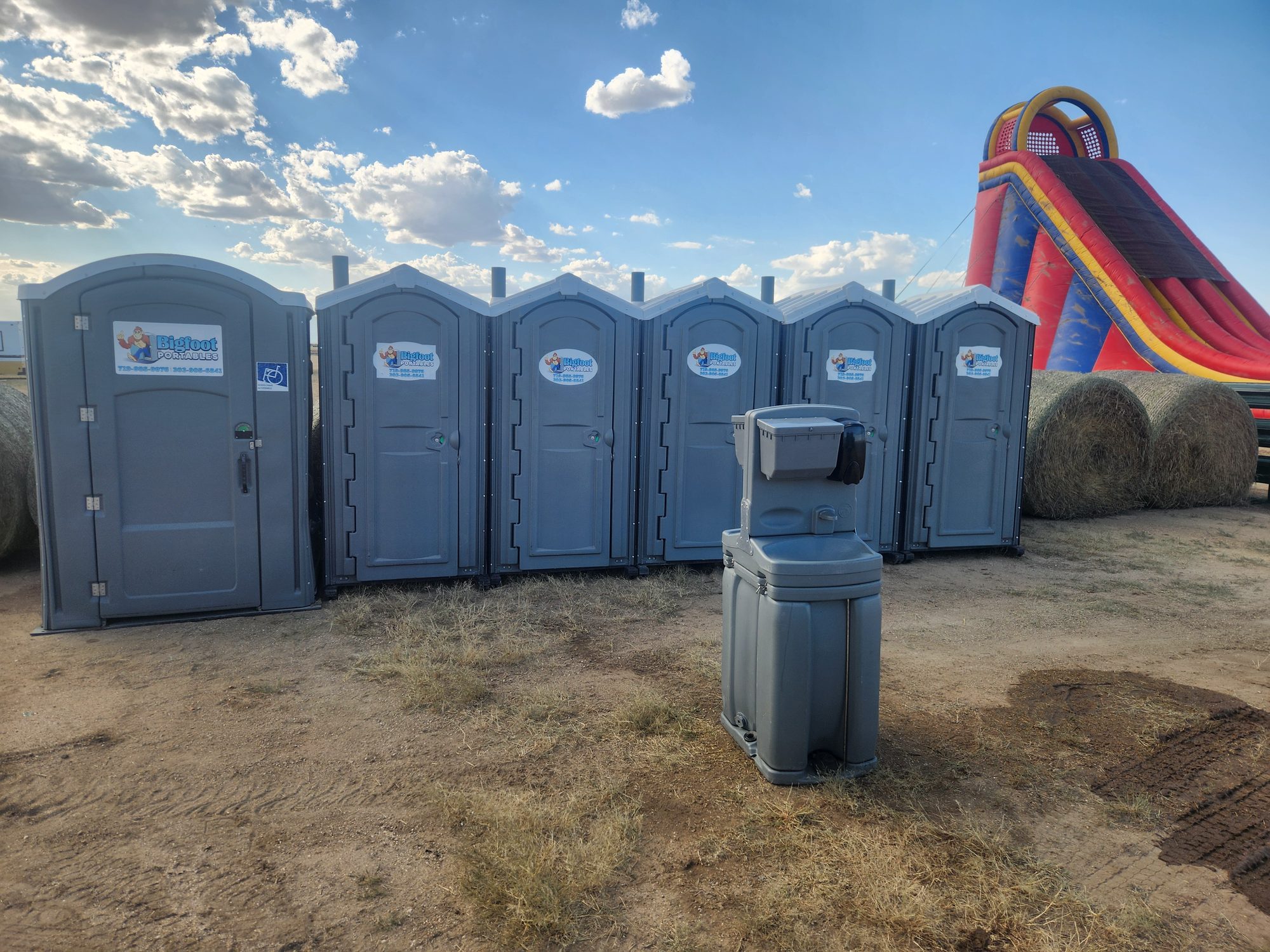 Bigfoot Portables porta potties, ADA unit, and handwash station set up for an outdoor event